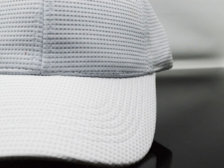 Gorra dri fit ojo de angel